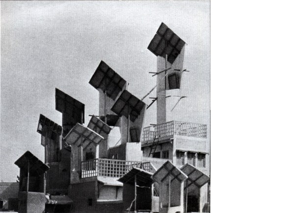 Hyderabad, Sindh, southern Pakistan; not Hyderabad, Andhra Pradesh, south India. Images from Bernard Rudofsky, Architecture without Architects, New York, Museum of Modern Art, 1964: windscoops (called bad-gir by Rudofsky, müg by Wikipedia) on the roofs of buildings, which channel air into their interiors. “In multistoried houses they reach all the way down, doubling as intramural telephones. Although the origin of this contraption is unknown, it has been in use for at least five hundred years.”